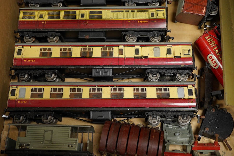 A collection of Hornby Dublo for 3-rail running, including two locomotives; a BR Duchess of Montrose, and a BR Standard Class 4MT 2-6-4T, together with four carmine and cream bogie coaches, nine freight wagons, a signal